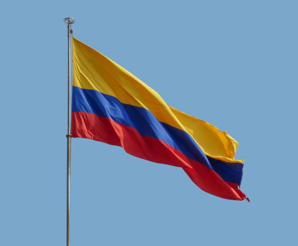 the colombian national flag in front of blue sky